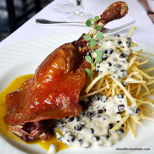 duck leg confit, orange - grand marnier beurre blanc w/ shoe string potato, pigeon peas