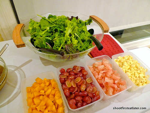 Salad greens w/ mixed fruit, cheese & poppy seed dressing