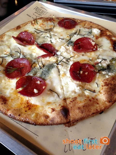 white pizza with double gorgonzola, mozzarella, Parmesan, garlic, rosemary & pepperoni
