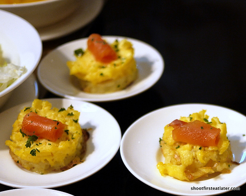 smoked salmon on scrambled eggs on potatoes